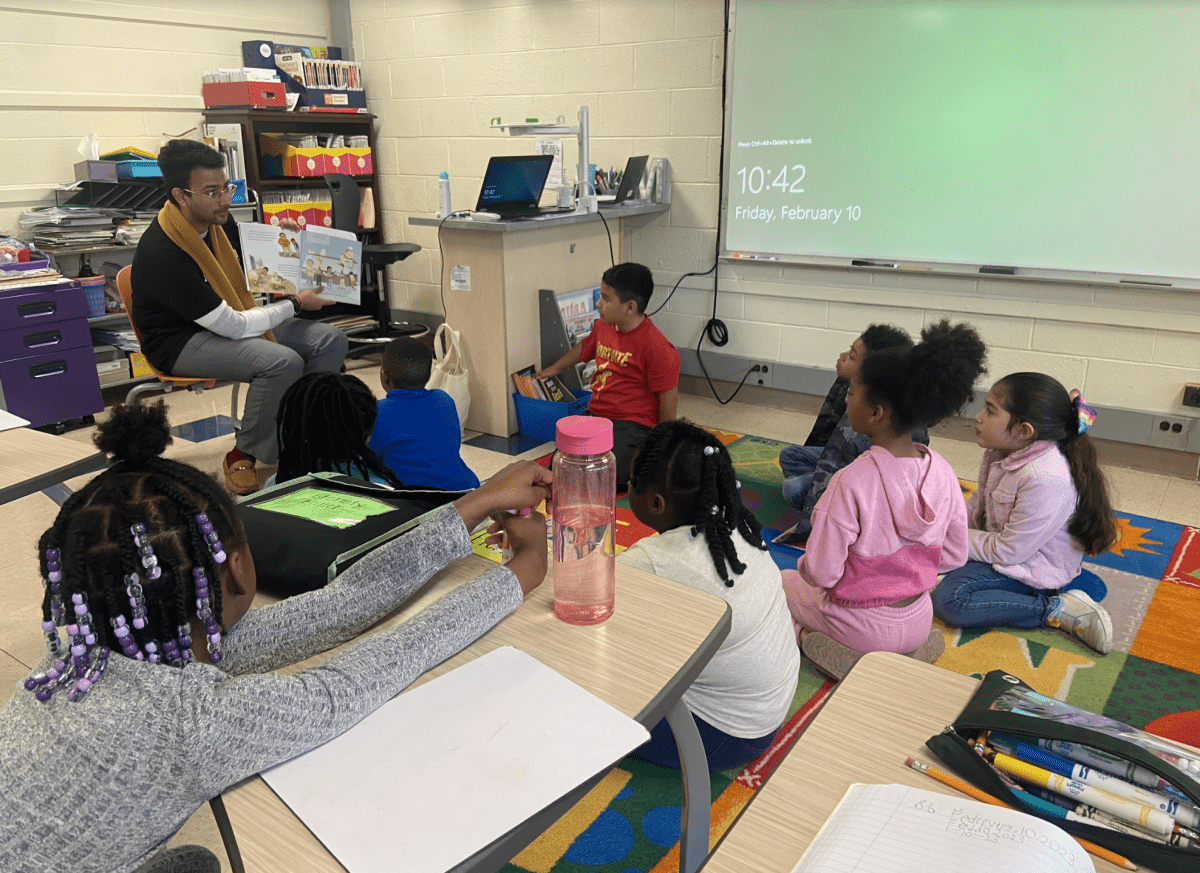 Teacher in training reading to students